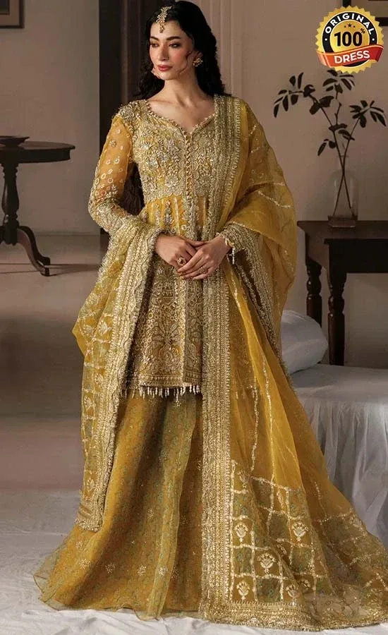 Yellow Lehenga Choli for Wedding Guests Yellow cotton satin lehenga choli with hand embellished panels and embroidered sleeves