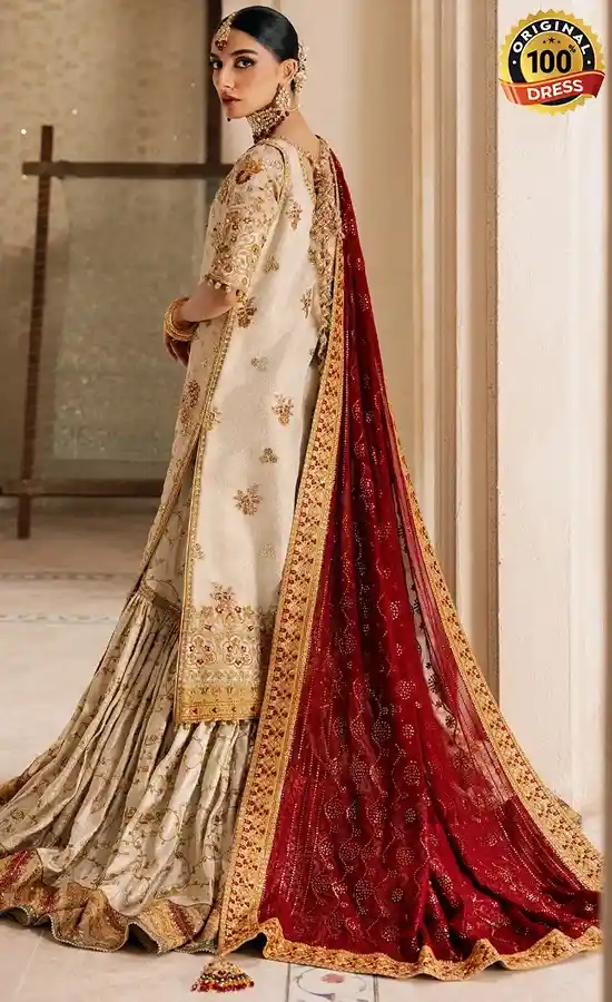 Embroidered white gharara suit for wedding guests with traditional Pakistani styling