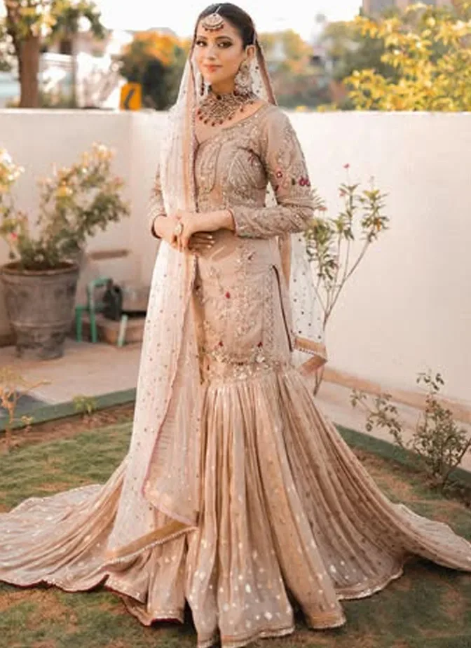 Light brown bridal gharara with tissue silk shirt, 14-kali Brocia Farshi gharara, organza dupatta and ivory-gold embroidery