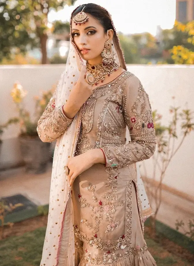 Pakistani Light Brown Bridal Gharara 003 Light brown bridal gharara with tissue silk shirt, 14-kali Brocia Farshi gharara, organza dupatta and ivory-gold embroidery