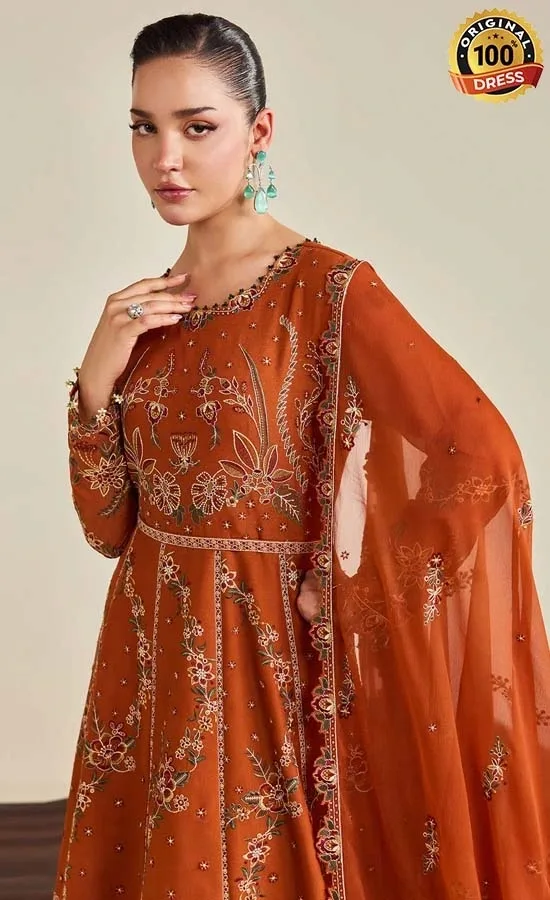 Pakistani orange Anarkali suit for wedding guests with intricate embroidery and elegant chiffon detailing