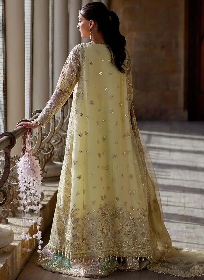 Yellow wedding guest suit with embroidered patchwork and decorative tassel finishing