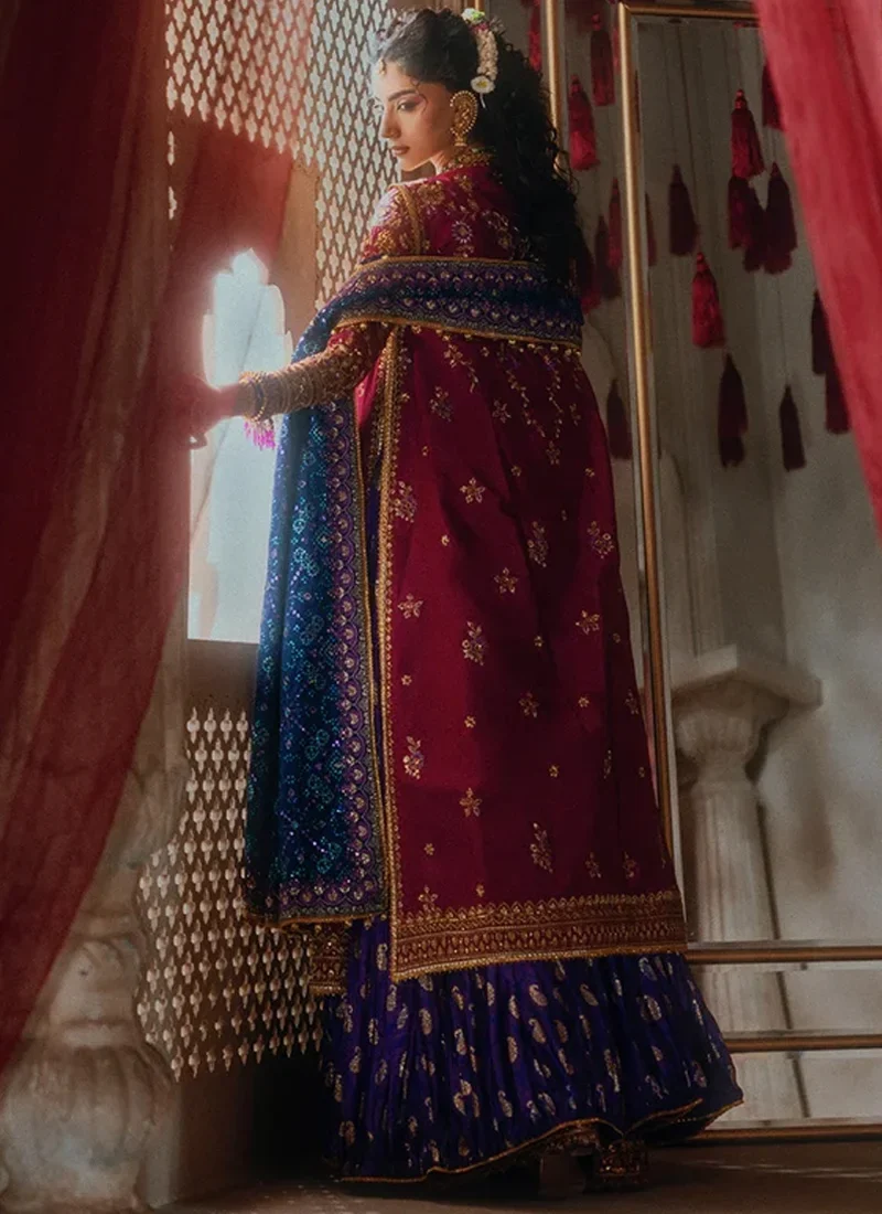 Royal blue salwar kameez for wedding guests with hand embroidery and decorative tassels
