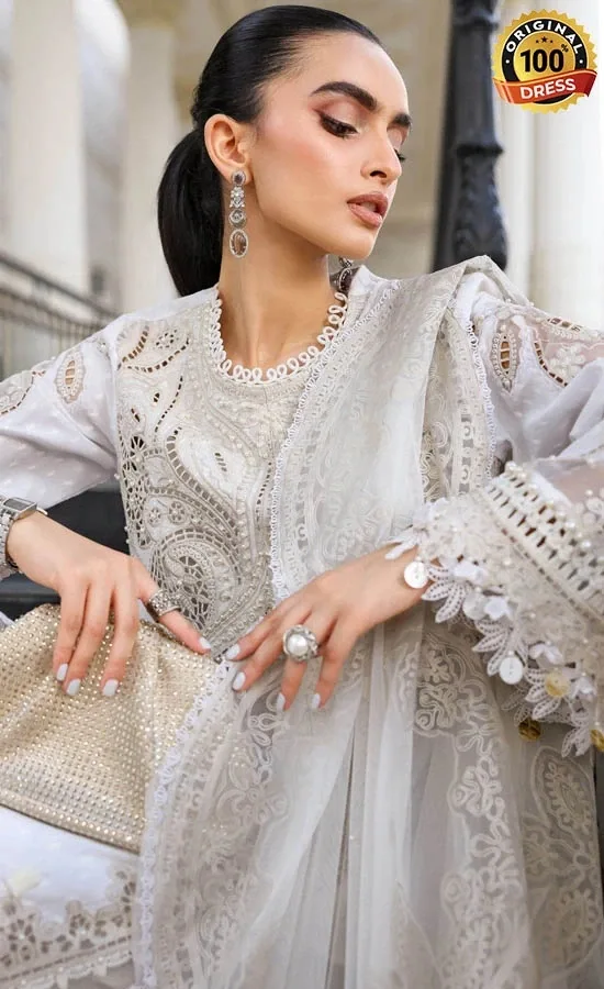 Embroidered white shalwar kameez with organza details and hand-finished embroidery