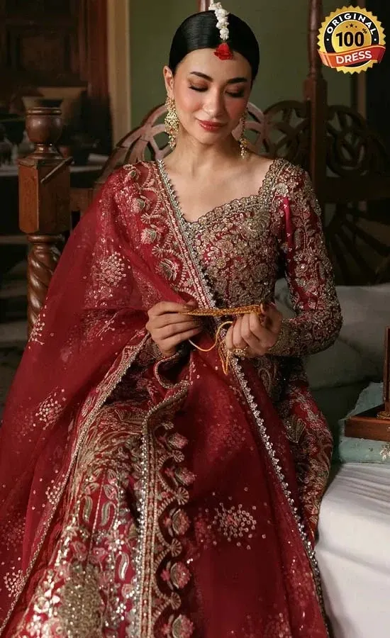 Maroon raw silk Anarkali dress with small pearls, tassels and detailed hand embroidery
