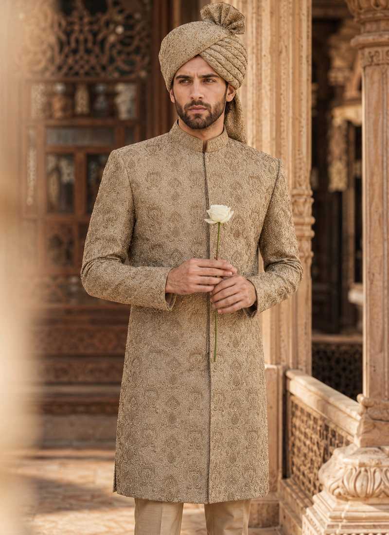 Groom wearing a beige wedding sherwani with a matching turban
