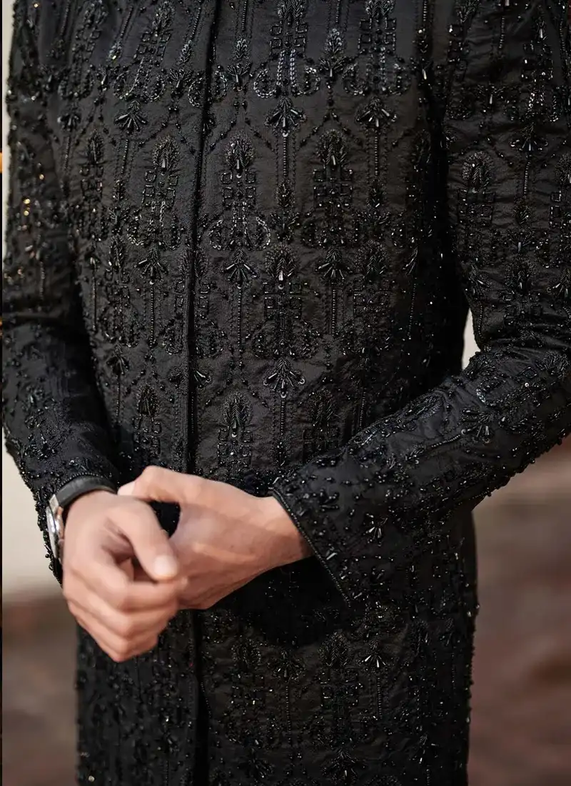 Close-up of black-on-black sherwani embroidery with sequins, pearls, kora and dabka