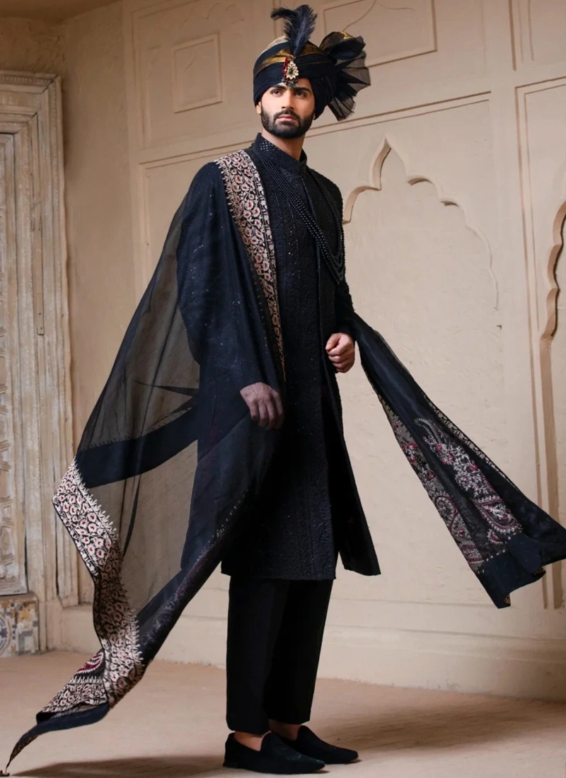 Black groom sherwani styled with black shawl and turban for a traditional wedding look