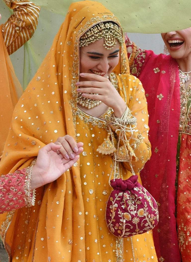 Embroidered yellow Mehndi bridal Angrakha with handcrafted embellishments and festive wedding styling