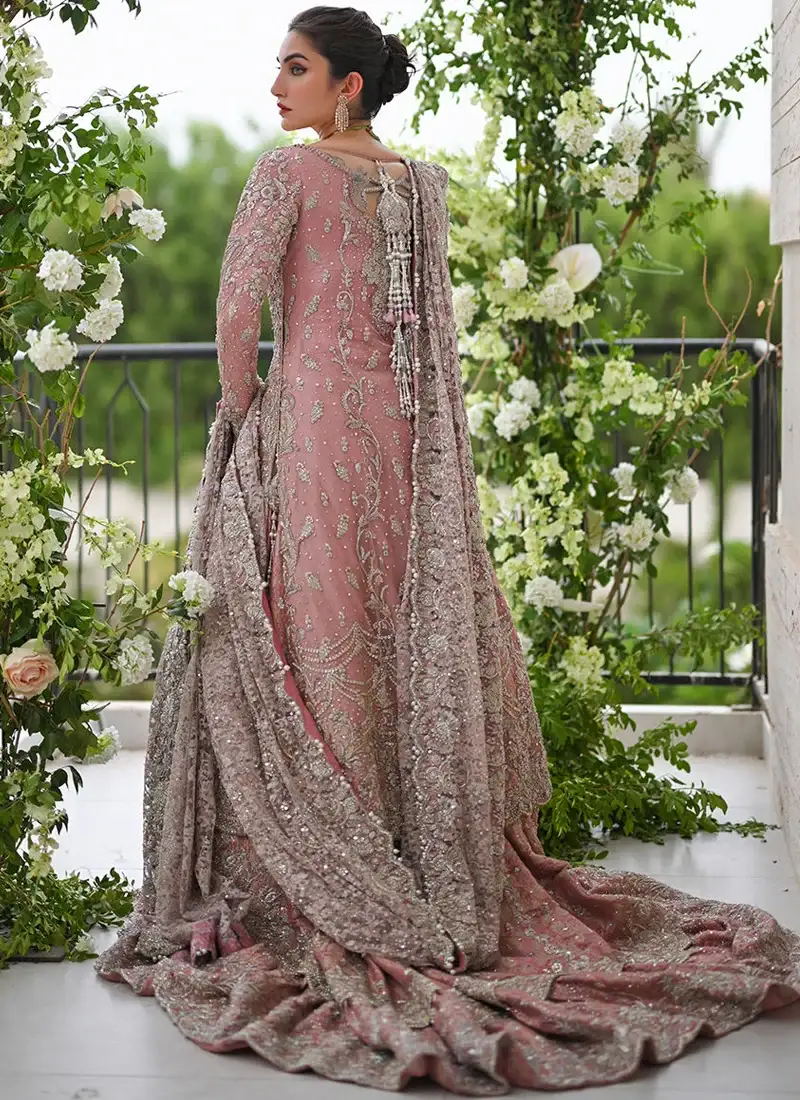 Pink bridal Farshi lehenga with circular full ghera, long trail and silver, antique-silver and rose-gold embroidery.