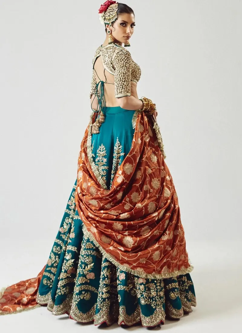 Zinc blue bridal blouse with high neck, full sleeves, dori back and concealed zip with hook-and-eye fastening