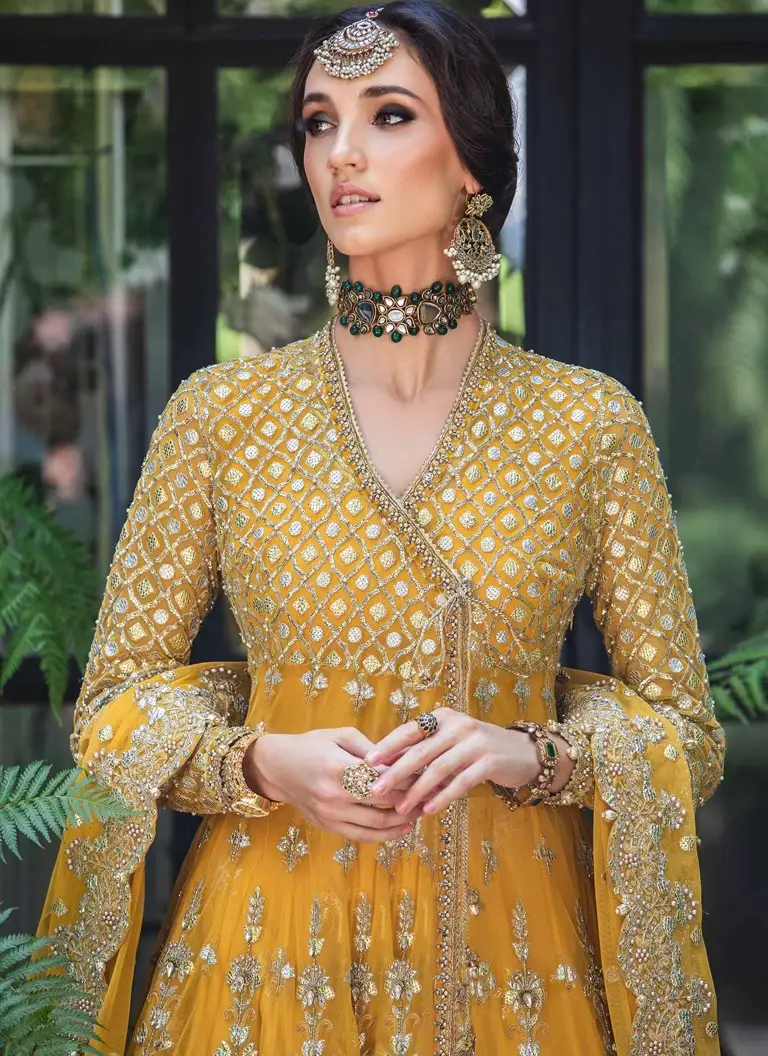 Mustard Mehndi Angrakha dress for bride with intricate embroidery and graceful festive styling