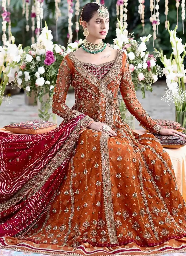 Orange and Gold Angrakha for Brides Orange and gold Angrakha for brides with elegant embroidery and traditional bridal styling