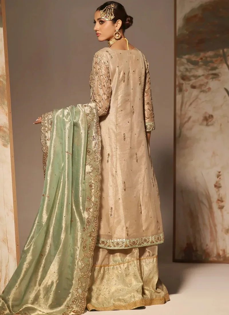Pakistani bridal Angrakha in champagne gold with flapper trousers and mint green dupatta