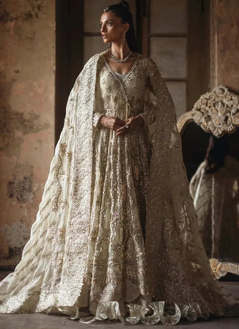 Pakistani Butter Yellow Angrakha Dress Pakistani butter yellow Angrakha dress for brides with traditional embroidery and graceful wedding styling