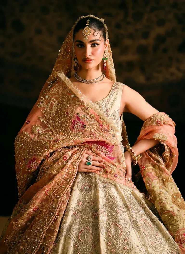 Pakistani ivory bridal lehenga with detailed hand embroidery and elegant wedding wear finishing