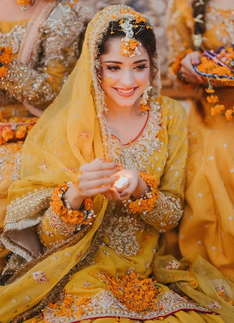 Pakistani yellow Mehndi bridal outfit with embroidered net shirt and traditional sharara stylin