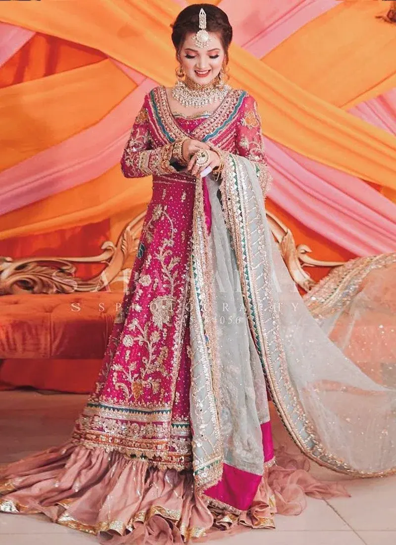 Pink bridal lehenga with mint dupatta and traditional Angrakha styling for wedding events