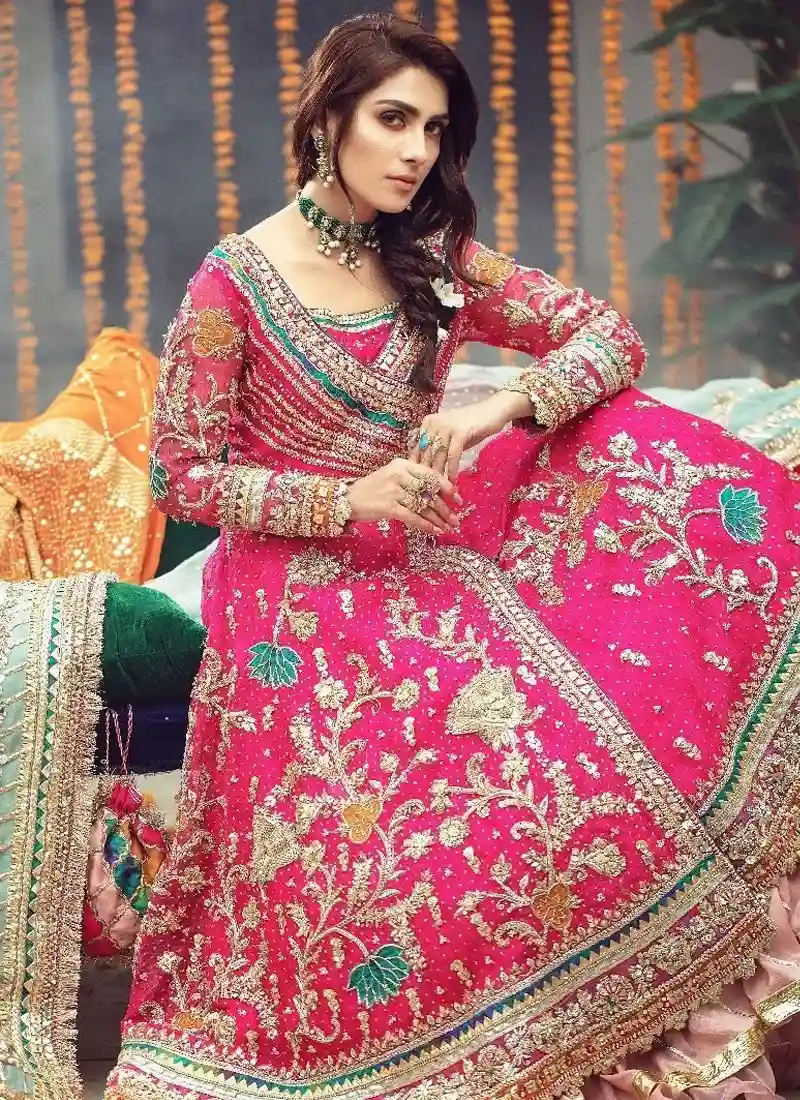 Pink and mint Pakistani bridal dress with Angrakha top, ruffled lehenga and contrasting dupatta