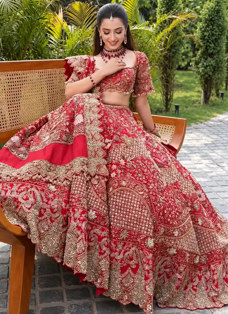 Rani Pink Indian Bridal Lehenga Choli Rani pink bridal lehenga choli with gold-toned floral arch embroidery and banded scalloped hem