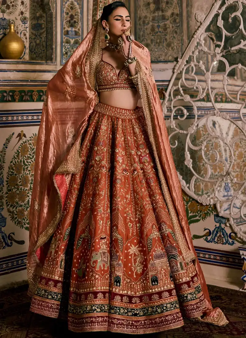 Rust Brown Bridal Lehenga with Zardozi Work Rust brown Indian bridal lehenga choli with intricate zardozi and resham embroidery