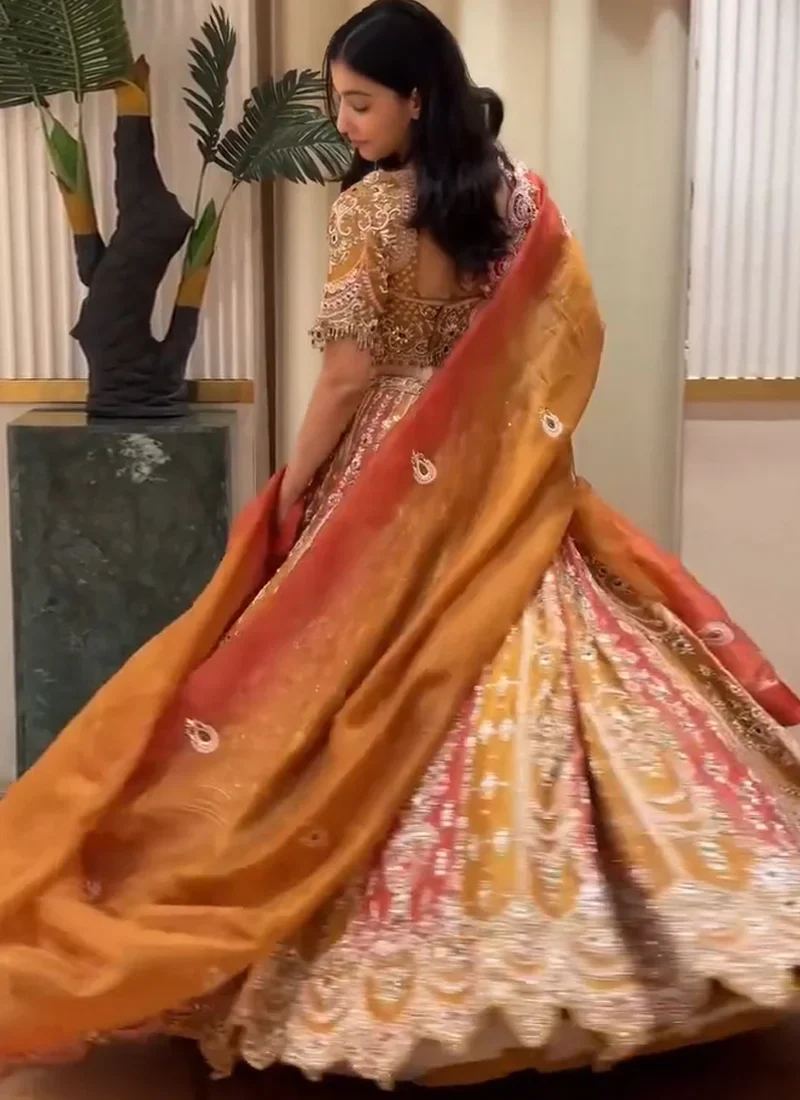 Orange and coral 14-kali lehenga choli with silver-toned seam embroidery and organza dupatta
