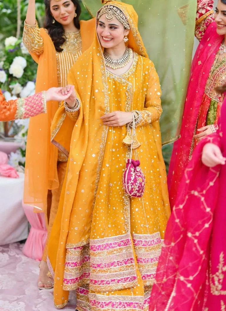 Yellow Bridal Angrakha for Mehndi Ceremony Yellow bridal Angrakha for Mehndi ceremony with intricate embroidery and elegant festive detailing