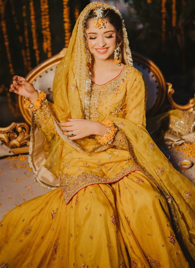 Yellow Mehndi sharara dress for bride with screen-printed raw silk and hand embellishments