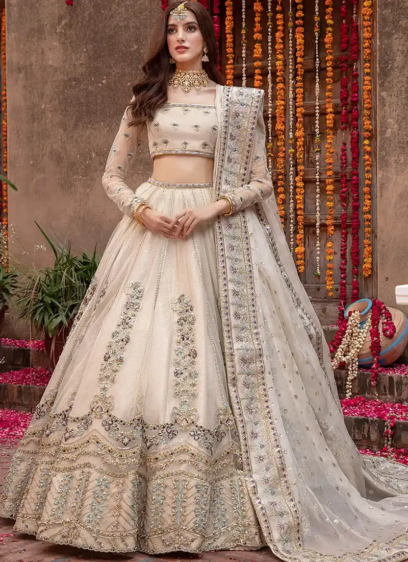Champagne bridal lehenga choli, full front view with vertical floral motifs and a wide embroidered dupatta border