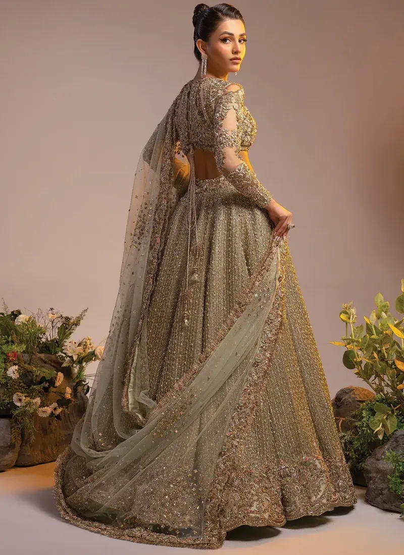 Gold lehenga choli extended skirt view with radiating sequins and embroidered scalloped hem