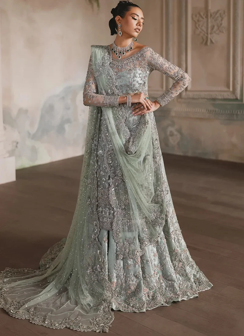 Ice Blue Nikkah Long Shirt with Lehenga with Scalloped Floral Dupatta Border Ice blue bridal long shirt and lehenga close-up with silver floral embroidery and ornate hem borders