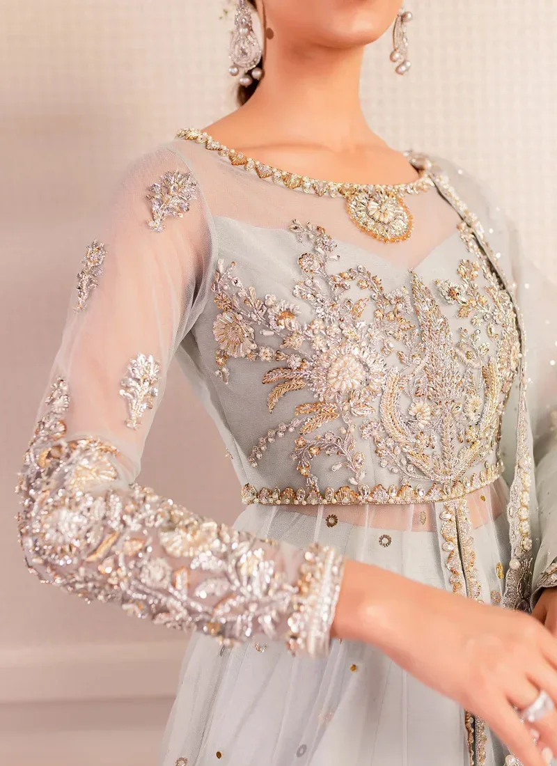 Ice blue gown front close-up showing floral medallion neckline, sheer yoke and embroidered sleeves