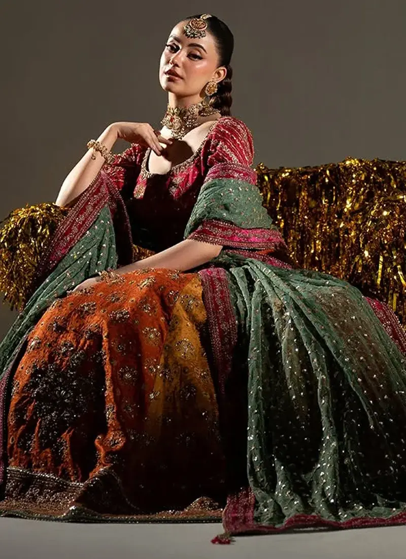 Pink embroidered Mehndi choli back view with deep round neckline, gold tassel ties and green net dupatta