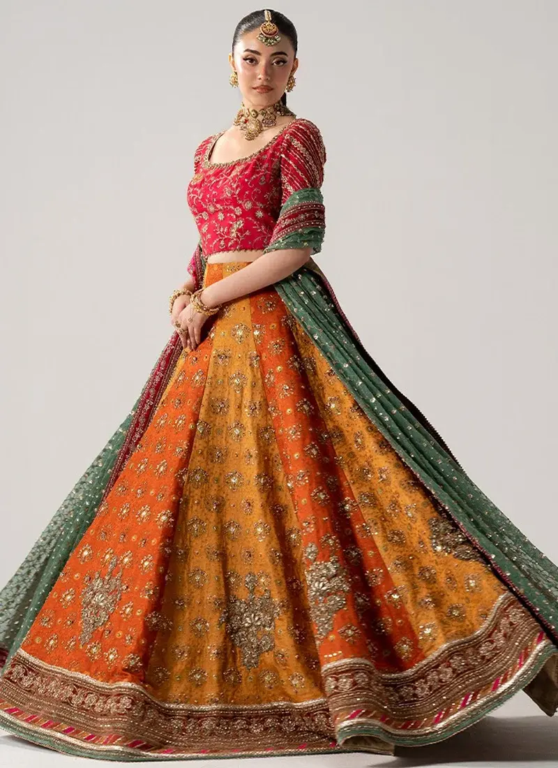 Orange Mehndi Lehenga Choli with Alternating Gold Panels Orange and pink Mehndi lehenga choli front view with scoop neckline, gold floral embroidery and green dupatta