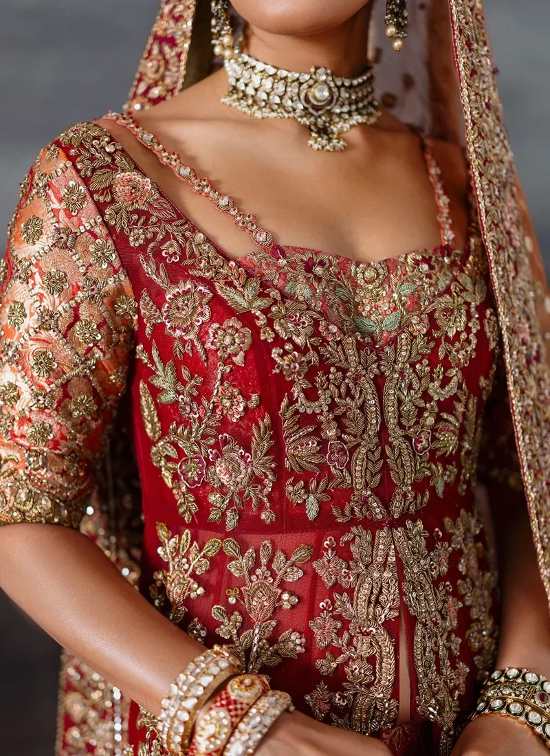 Red bridal gown full front view with scalloped gold medallion hem and sheer copper tissue dupatta