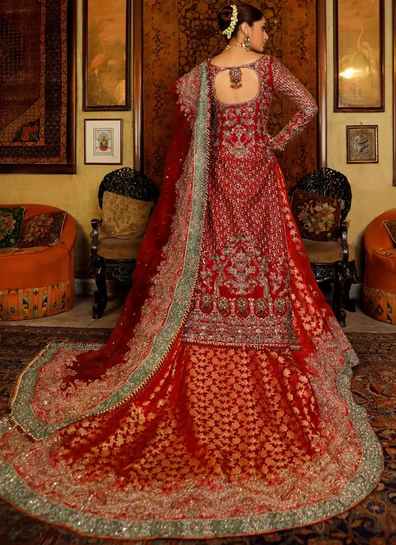 Red bridal long shirt close-up showing gold floral embroidery, lattice patterns and an embellished sleeve