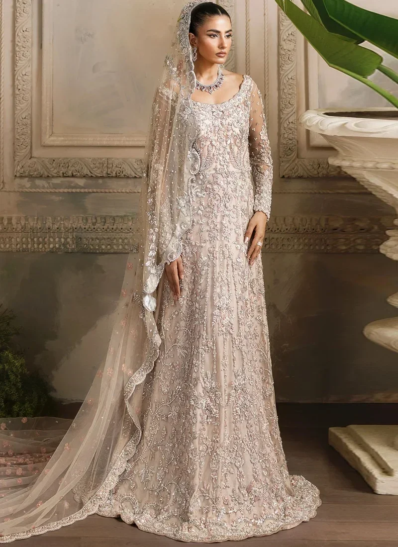 Red Walima Gown with Scalloped Floral Veil Peach bridal gown side close-up showing a square neckline, pearl embroidery and sheer net sleeves