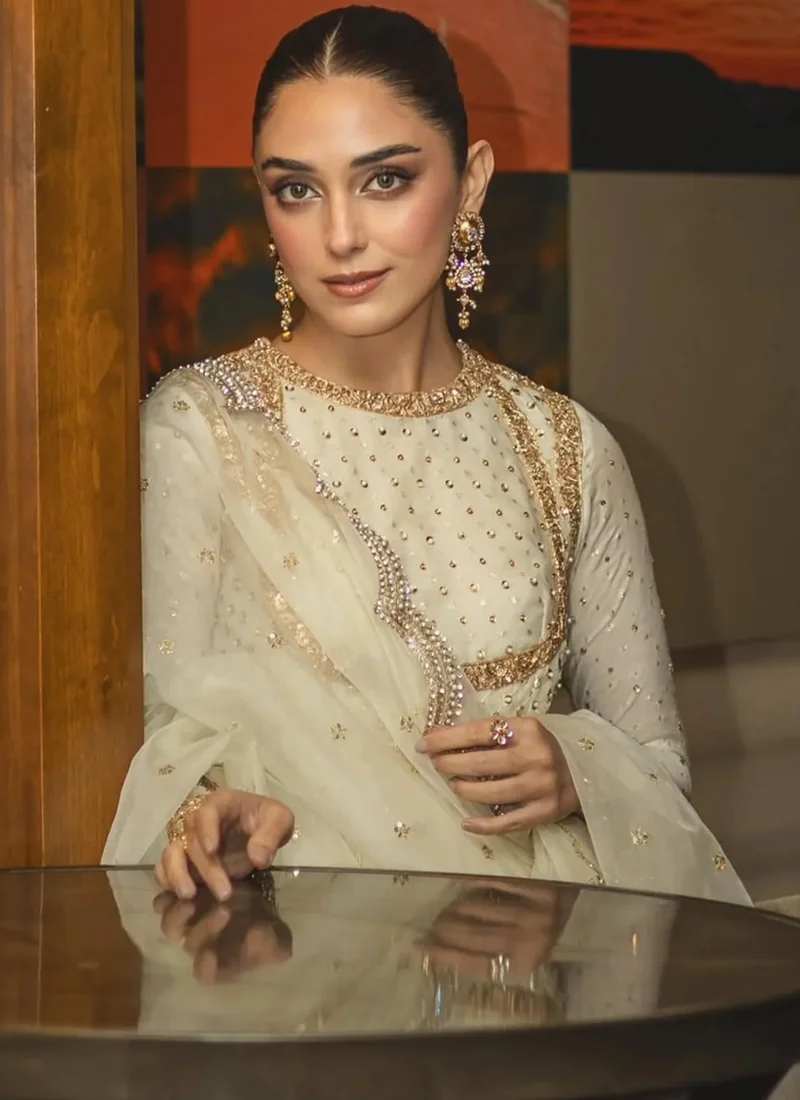 White Mehndi Pishwas with Gold Striped Hem White and gold pishwas side close-up showing embellished shoulder, fitted sleeve and sheer dupatta