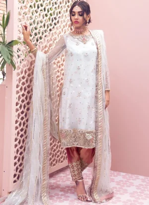 White net kameez close-up with sheer embroidered sleeves, ornate gold floral hem and braided dupatta border
