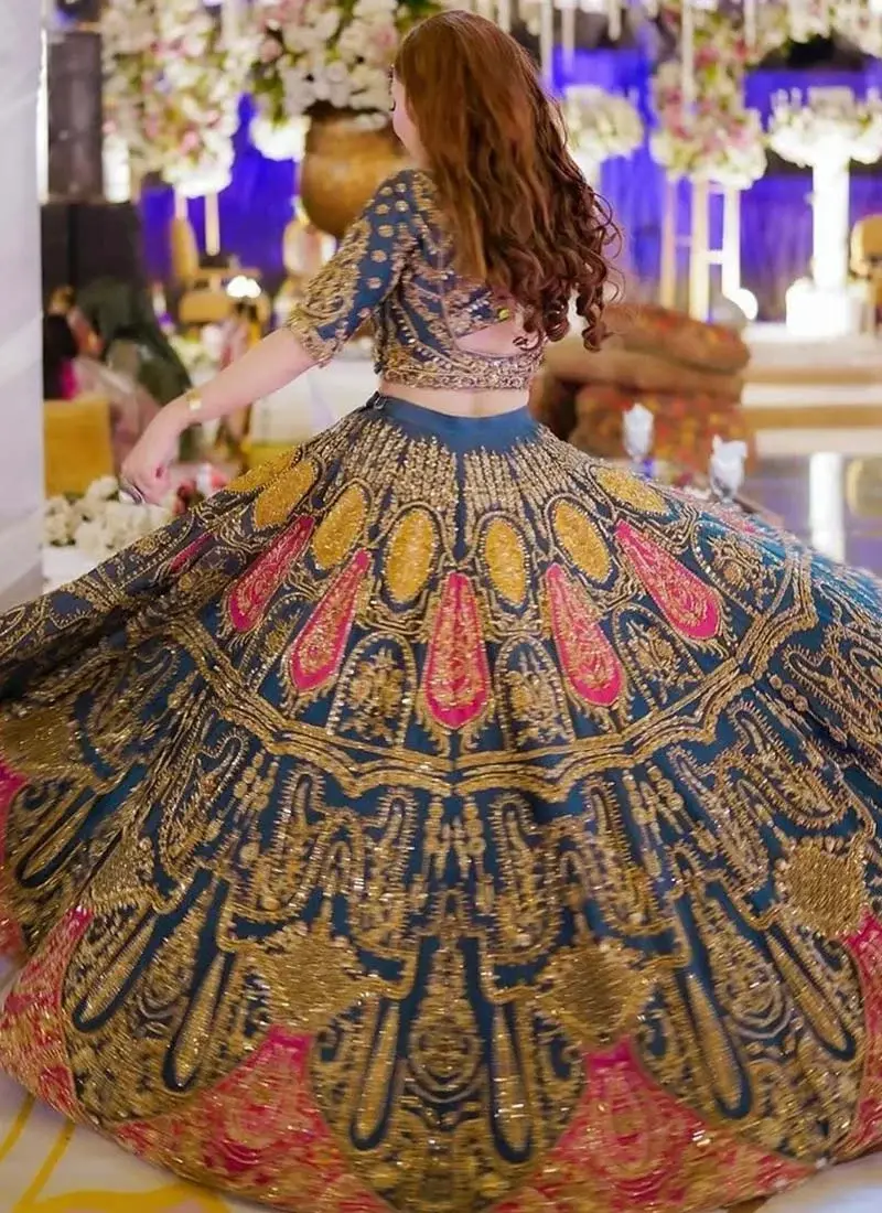 Zinc blue mehndi lehenga choli with a wide embroidered flare and fuchsia paisley motifs